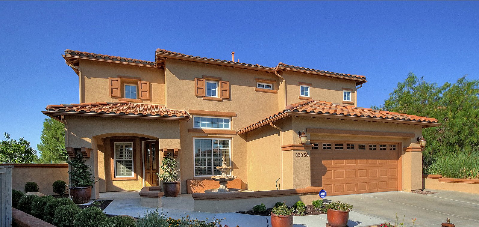 THE HENSLEY GROUP REAL ESTATE - front view of a 2-storey brick house